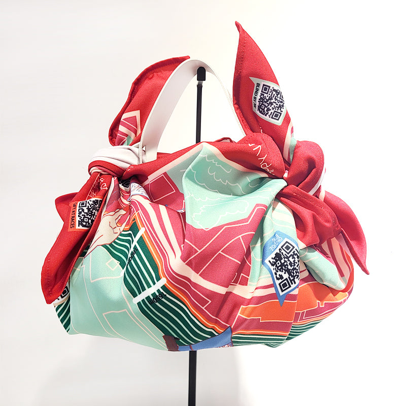 DiSCARVERY Wrap Bag X Jockey Club featuring a colorful map print, designed for eco-friendly travelers.